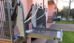 Outdoor Wheelchair Platform Lift: Compact, Durable, and Easy to Install Outdoor wheelchair platform lift raised to landing height at a home entrance door