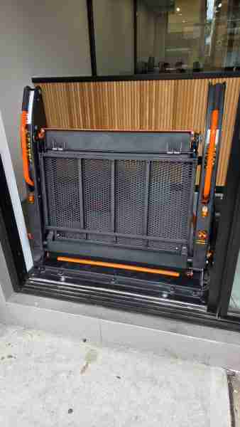 Outdoor Wheelchair Platform Lift: Compact, Durable, and Easy to Install Wheelchair platform lift being installed at a commercial entrance in Sydney by Gilani Engineering technicians