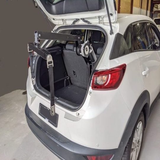 Wheelchair hoist for cars fitted in a vehicle boot