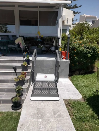 Outdoor Wheelchair Platform Lift: Compact, Durable, and Easy to Install Outdoor wheelchair platform lift installed at a raised home entrance for step-free access