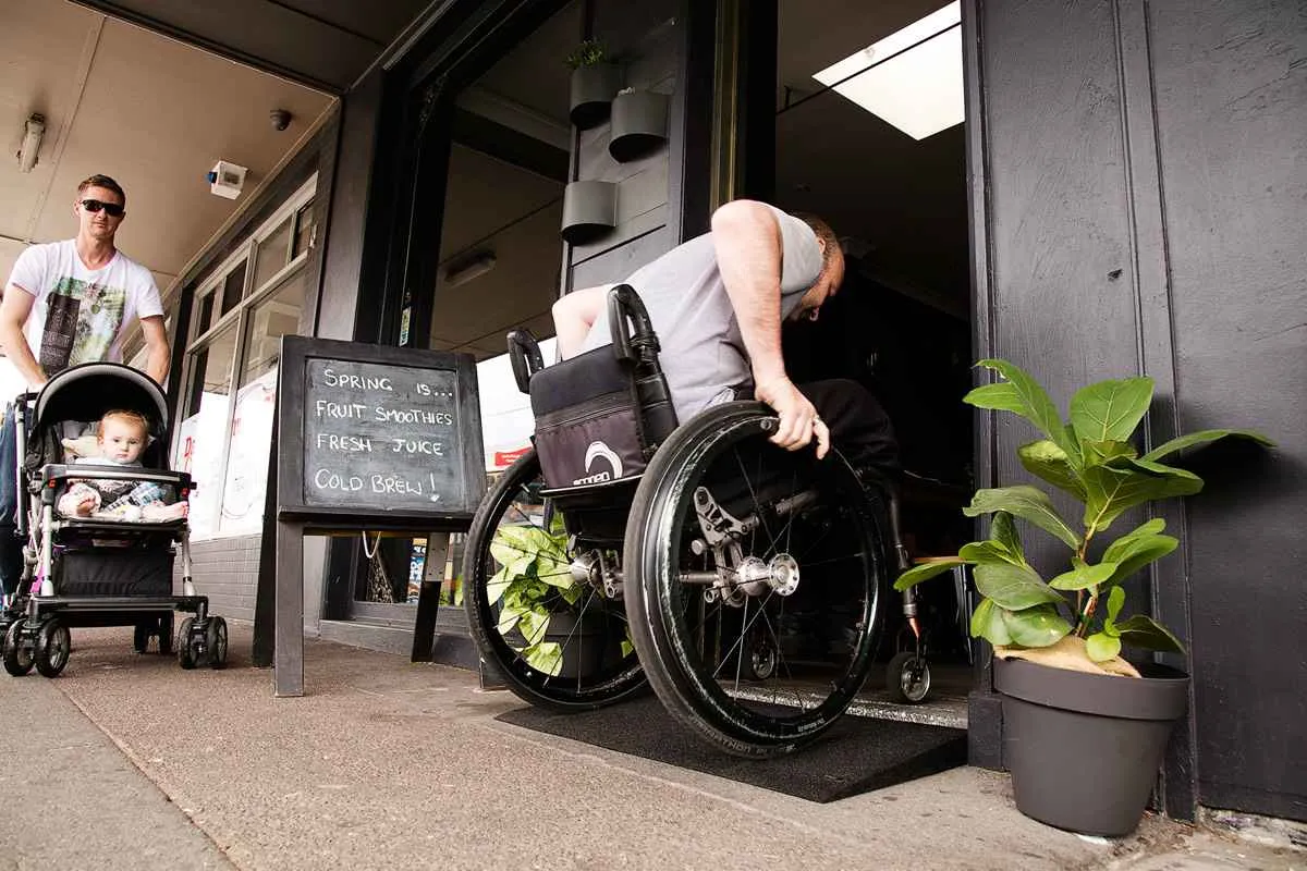 Man using wheelchair ramp