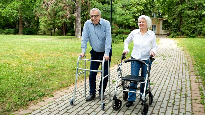 People with walking aids in park (1) People with walking aids in park (1)