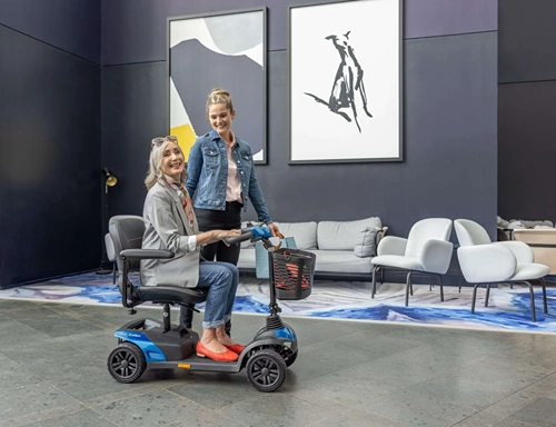 Woman riding Mobility Scooter with Daughter