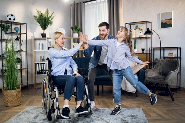 Mother on Wheelchair Happy with Family Mother on Wheelchair Happy with Family